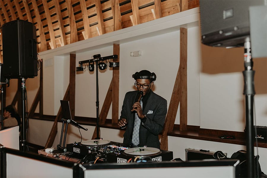 The DJ playing music.