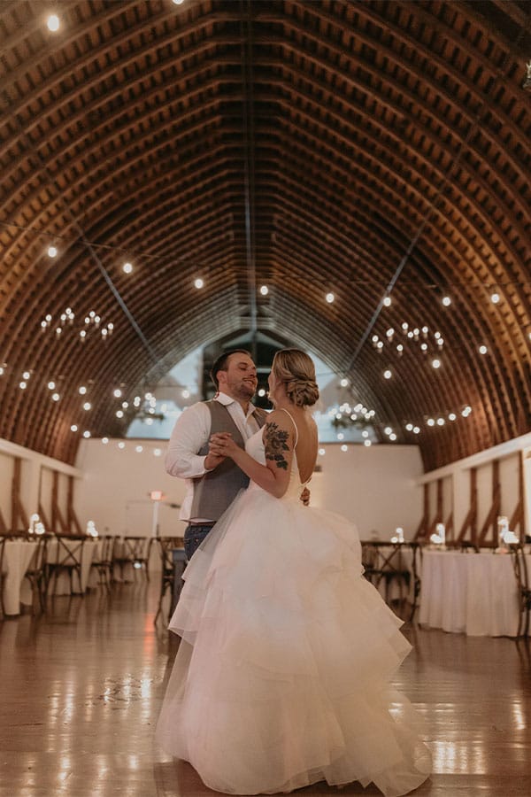 The bride and groom dancing alone. 