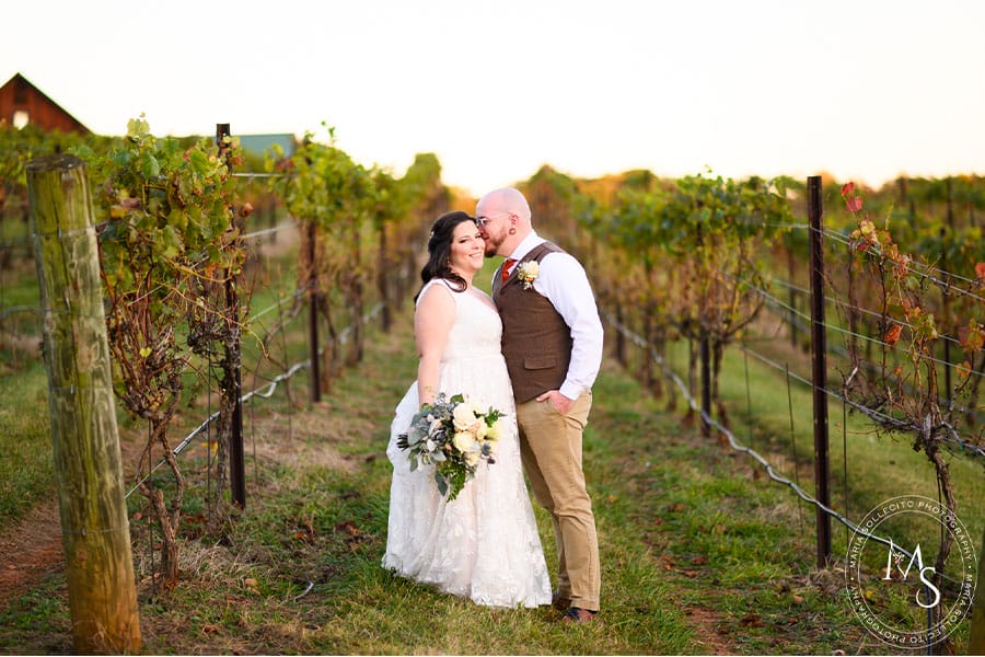 The bride and groom in a orchard.