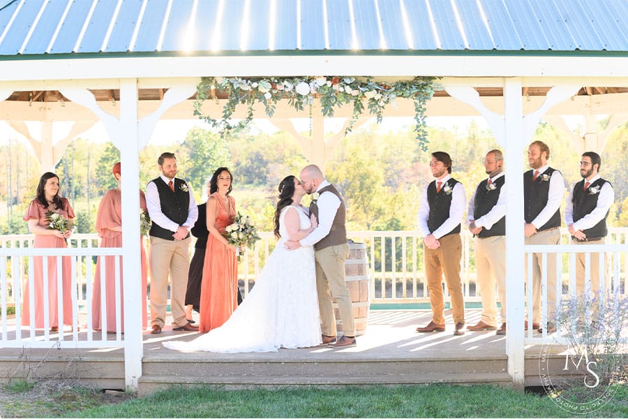 The bride and groom kissing.