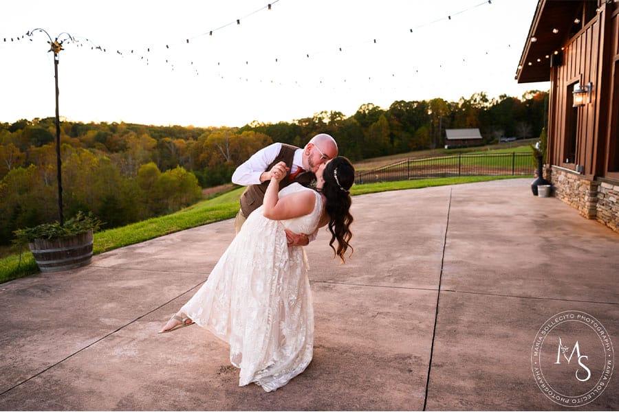 The bride and groom kissing alone.