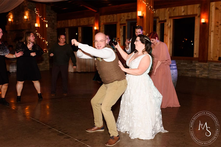 The bride and groom partying on the dance floor.