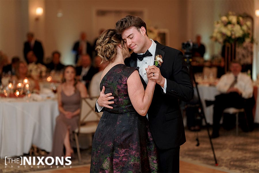 The groom dancing with his mother. 