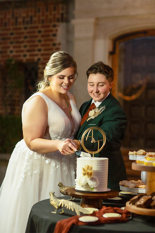 The couple cutting there wedding cake. 