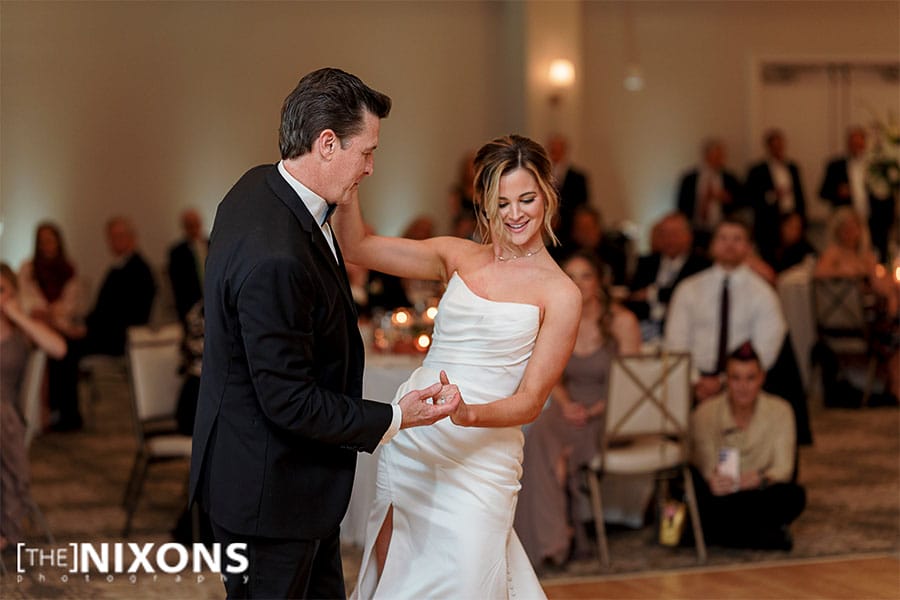 The bride dancing with her father. 