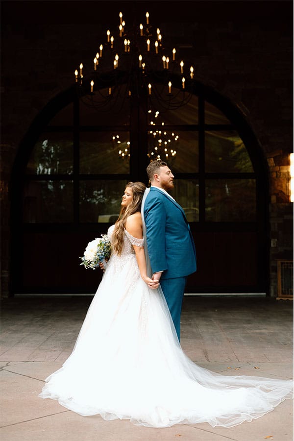 The bride and groom back to back.