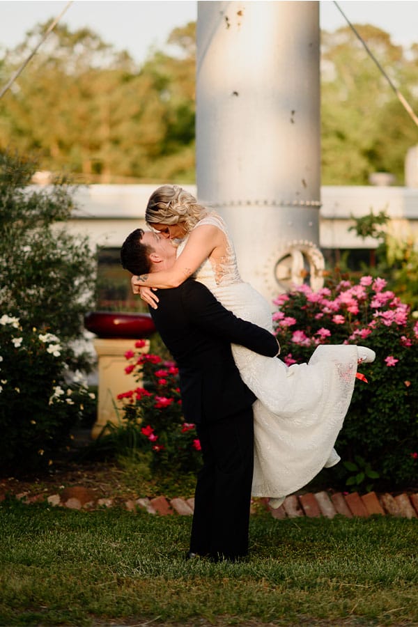 The bride and groom kissing. 