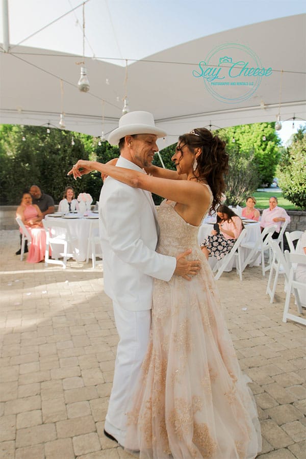 The bride and groom dancing together. 