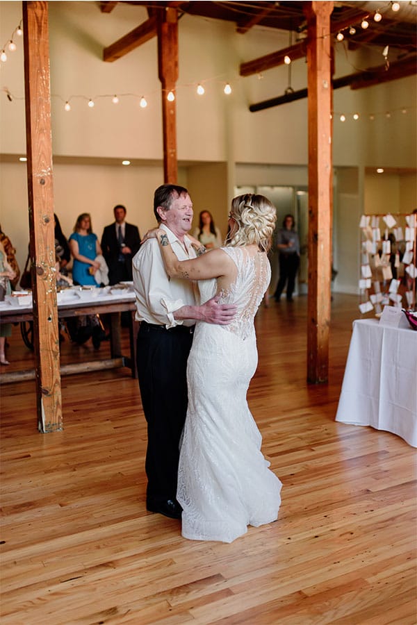 The bride dancing with her dad. 