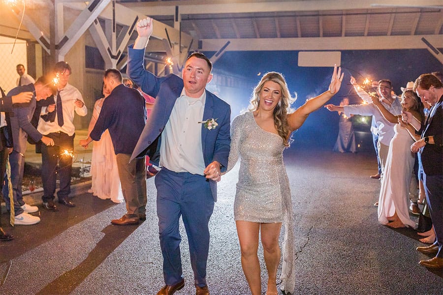 The bride and groom leaving the venue. 