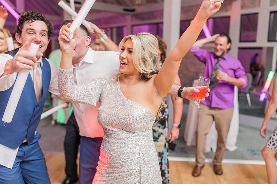 The bride and groom dancing together. 