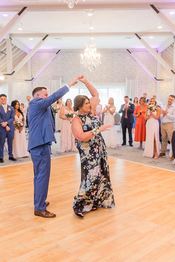 The groom dancing with his mother. 