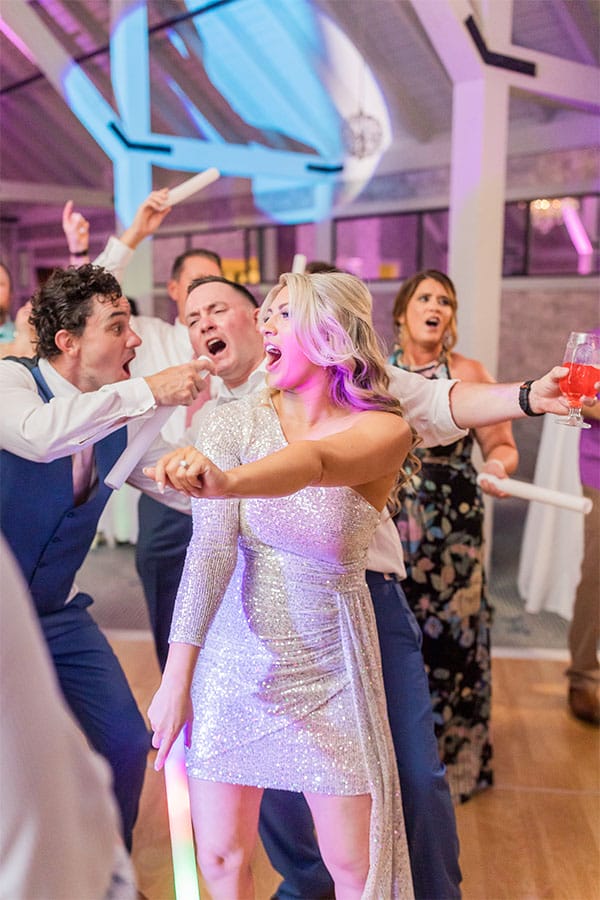 The bride and groom dancing together. 
