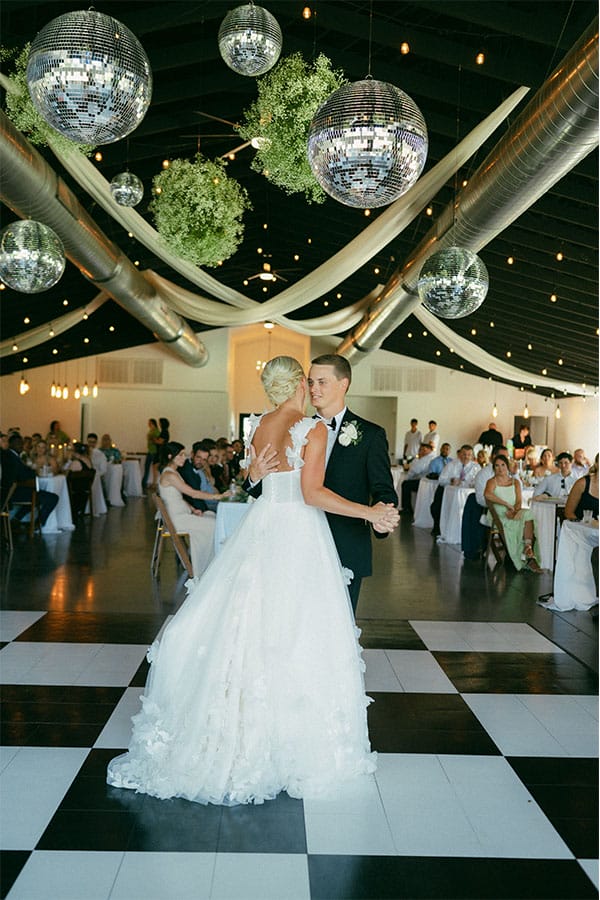 The bride and groom dancing together. 