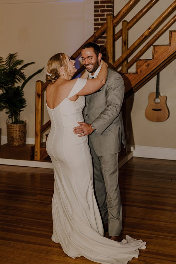 The bride and groom dancing together.