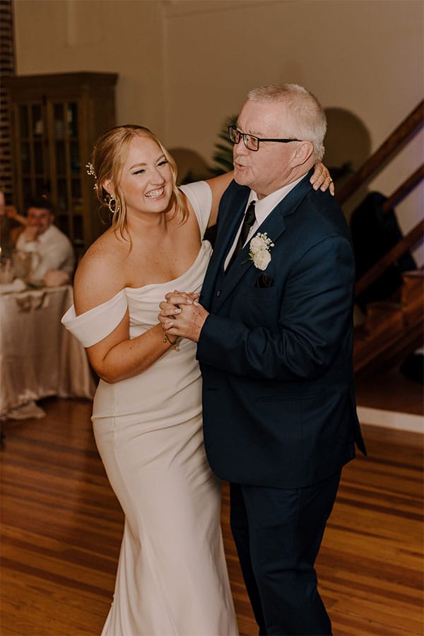 The bride dancing with some one. 