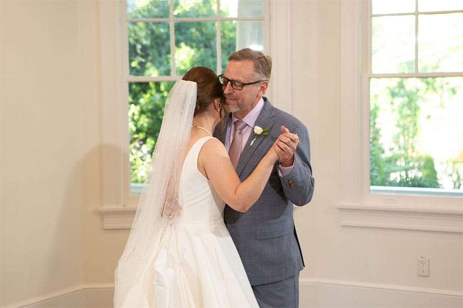 The bride dancing with her father.