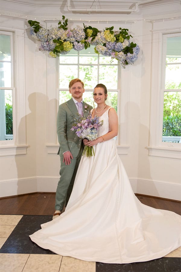 The bride and groom standing together.