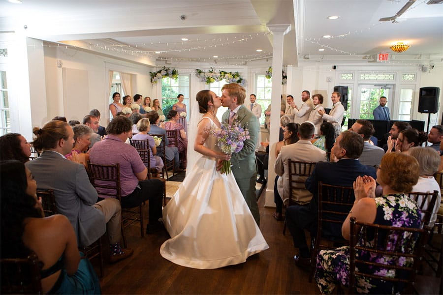 The bride and groom kissing.