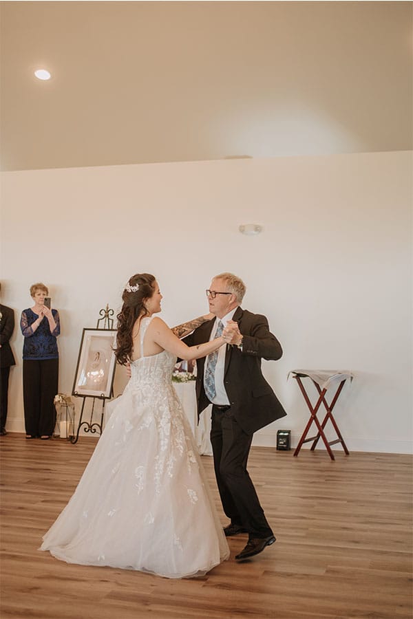 The bride dancing with her father.