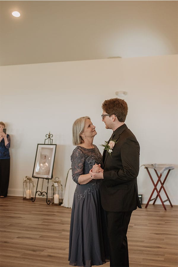 The groom dancing with his mother. 