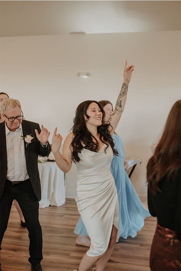 Friends and family of the couple dancing. 