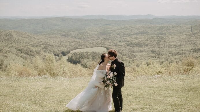 The bride and groom kissing.