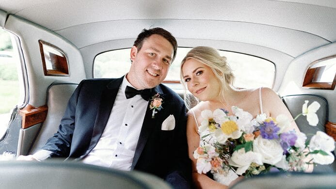 bride and groom in car