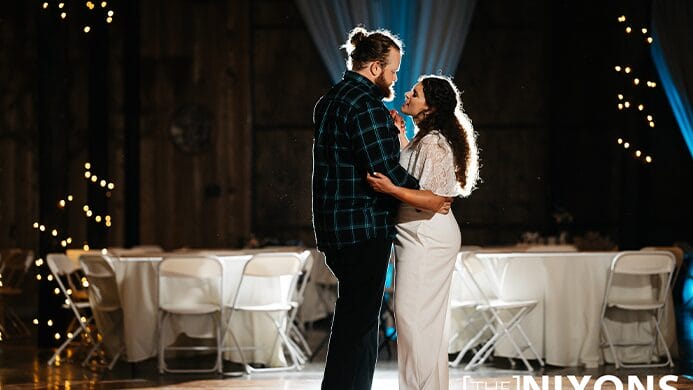 The bride and groom dancing together.