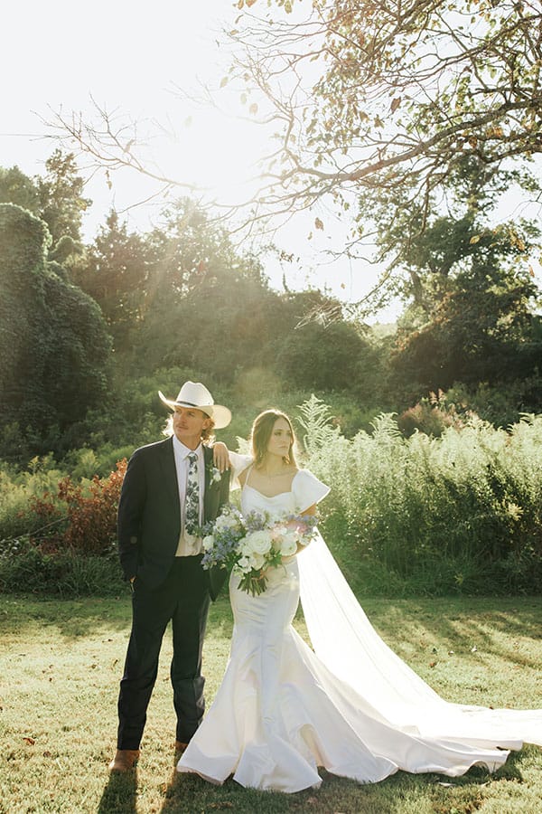 The bride and groom are standing together.
