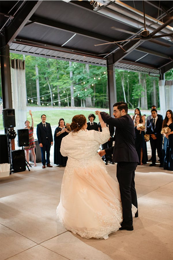 The bride and groom dancing together. 