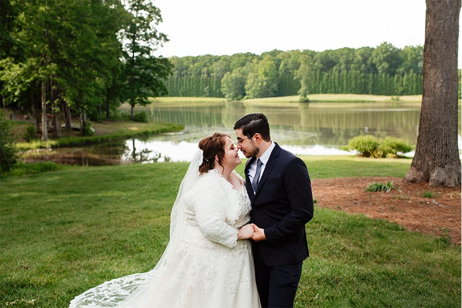 The bride and groom looking at eachother.