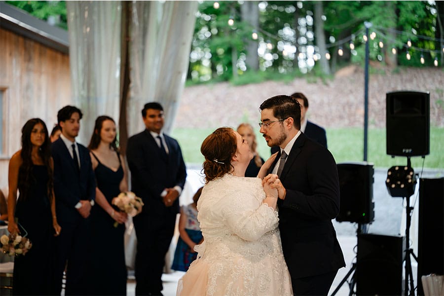 The bride and groom dancing together. 