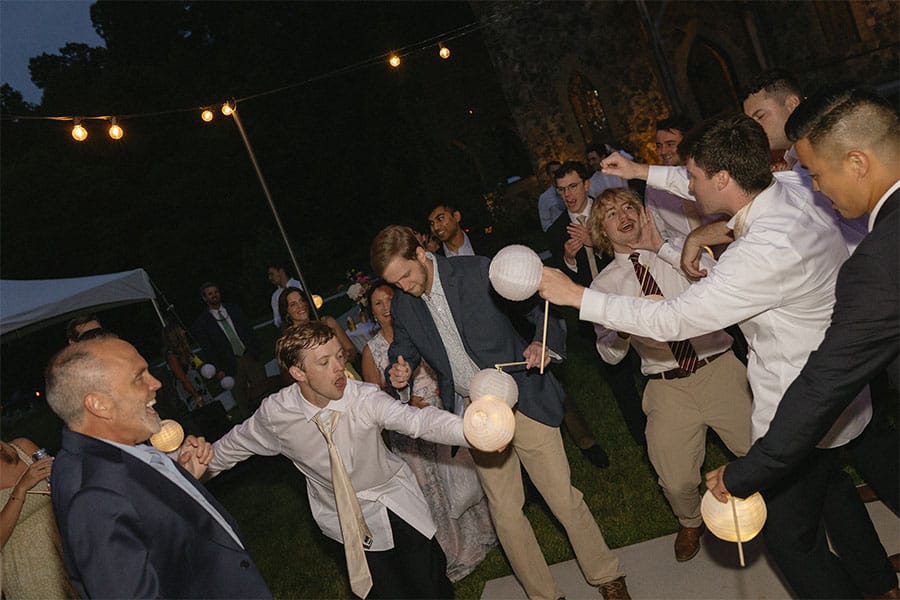 The bride and grooms loved ones dancing.
