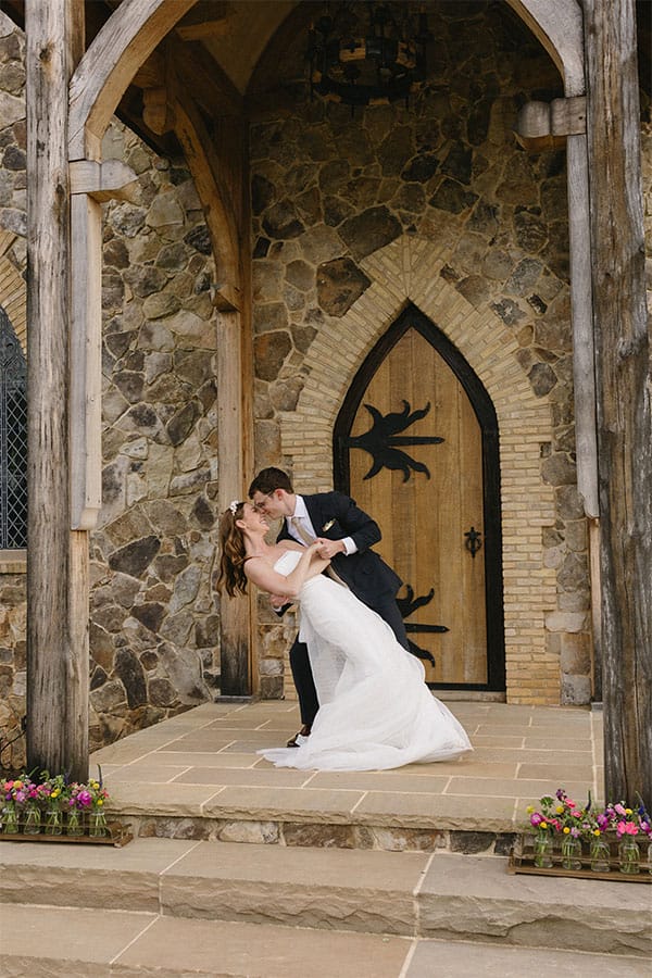 The groom kissing the bride. 