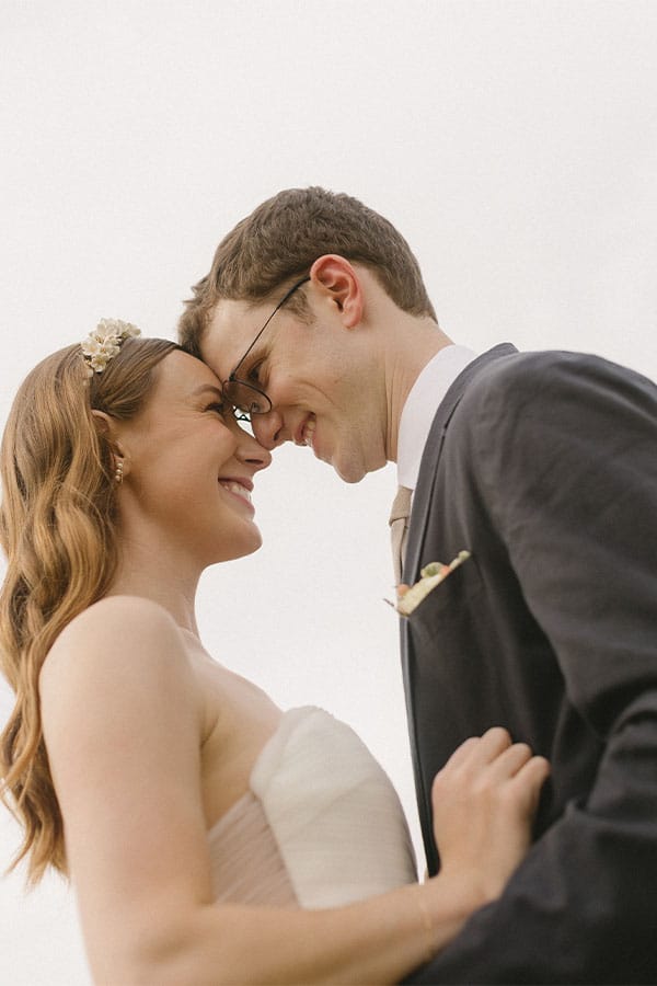 The bride and groom looking at eachother face to face.