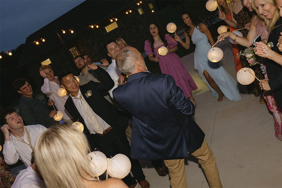 The bride and grooms loved ones dancing. 