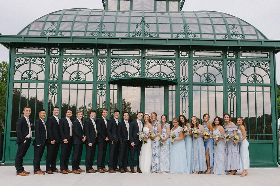 The bride and groom with their grooms men and brides maids.