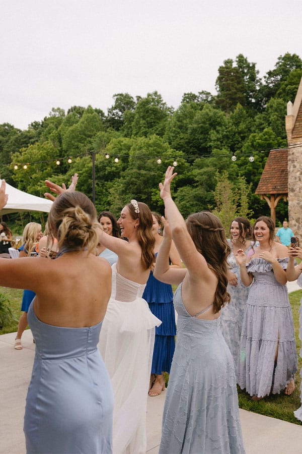 The bride and grooms loved ones dancing.