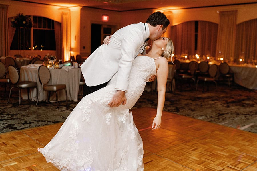 The bride and groom kissing. 