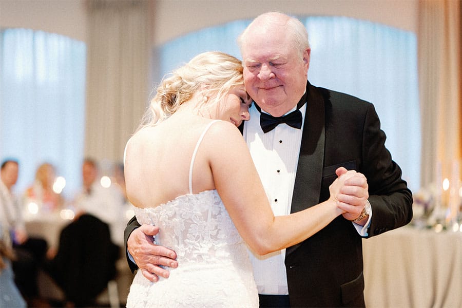 The bride dancing with her father. 