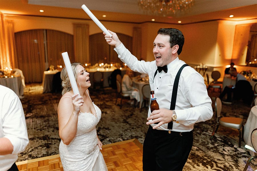 The bride and groom dancing together. 