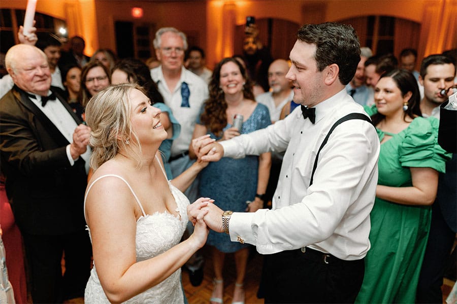 The bride and groom dancing together. 