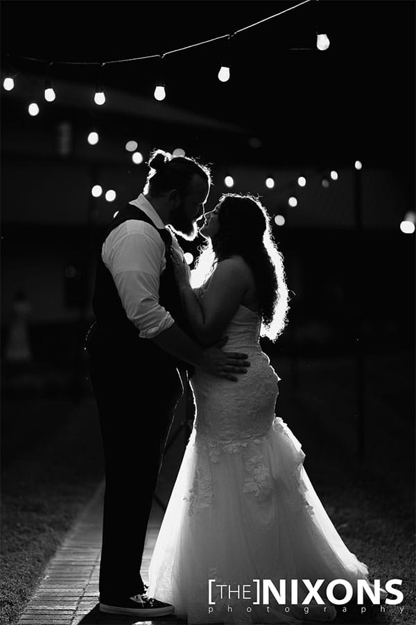 The bride and groom dancing together.