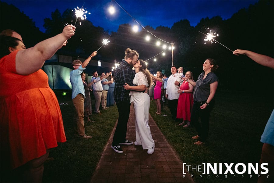 The bride and groom kissing. 