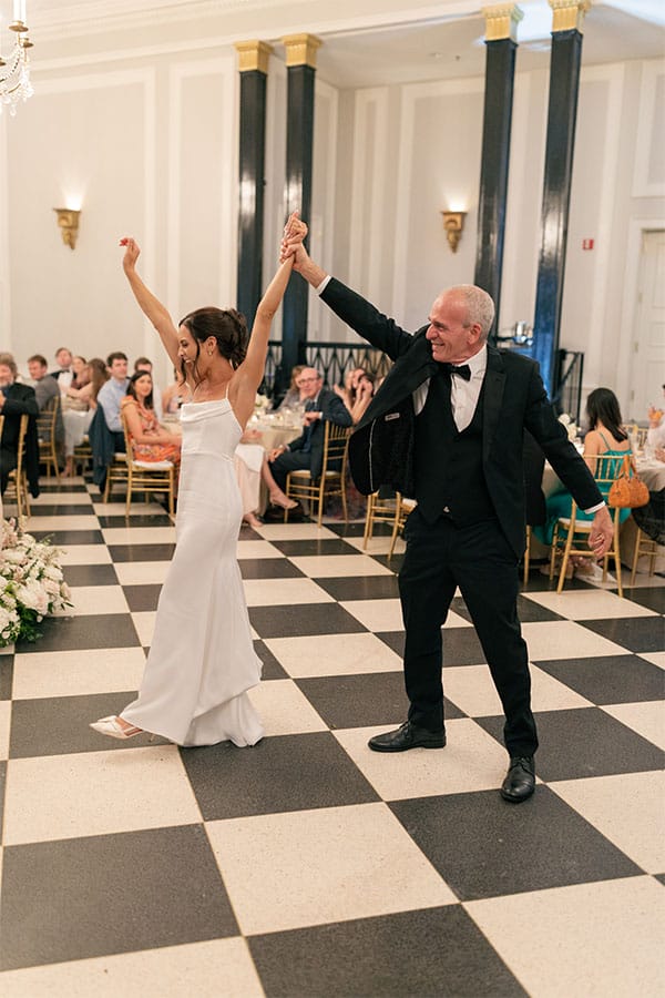 The bride dancing with her father. 