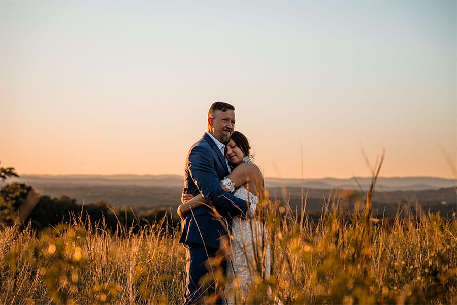 The bride and groom hugging. 