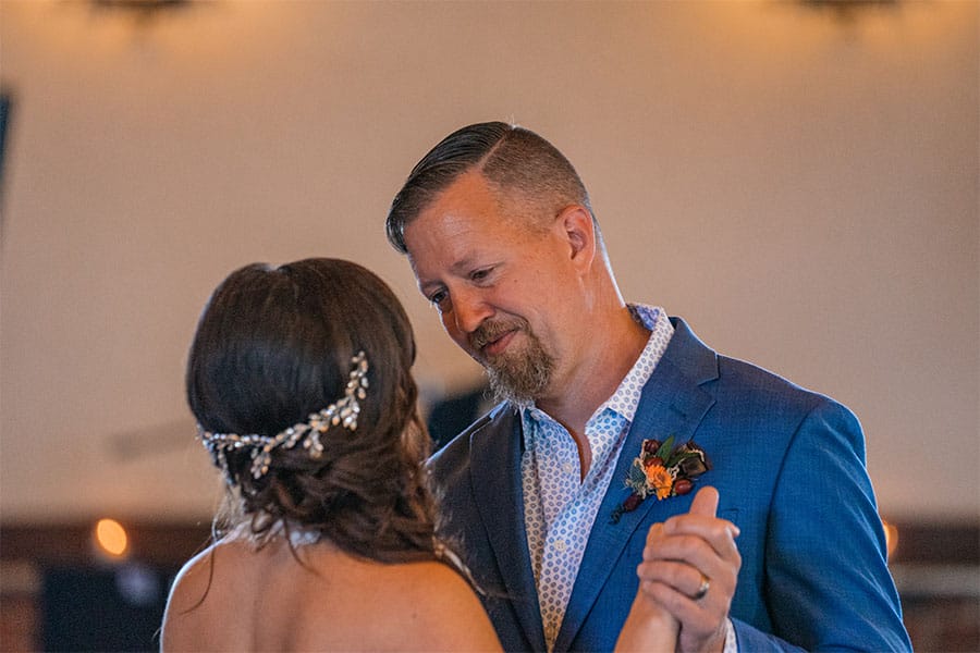The bride and groom dancing together.