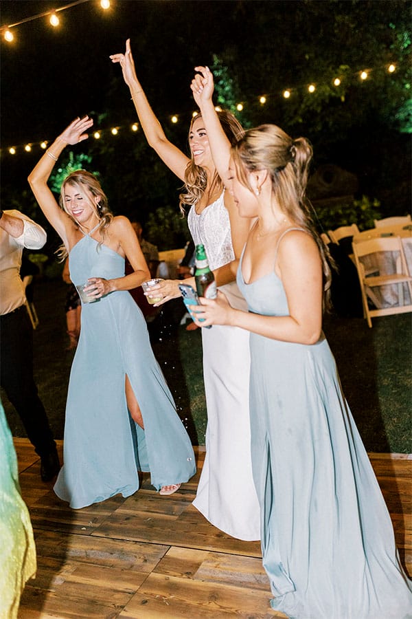 The bride dancing with loved ones. 