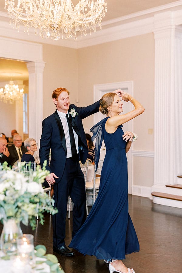 The groom dancing with his mother. 